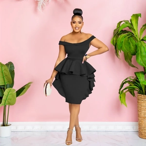 Chic black off-shoulder ruffle dress with tiered skirt layers on a fashion model