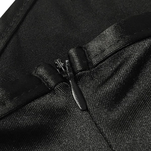 Detail of invisible zipper and ribbed fabric on a sexy V-neck solid color evening gown