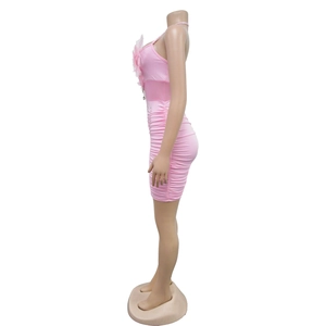 Pink bodycon mini dress featuring lateral ruching details and tone-on-tone feather trim