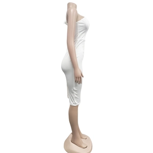 Side view of white slim-fit dress showing the body-con silhouette and knitted fabric texture