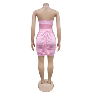 Detail view of pink ruched bodycon mini dress with back zipper and mesh waist panel