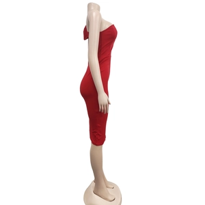 Detail of red off-shoulder bodycon dress showing sleek fit and high-stretch fabric