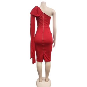 Detail showing the large shoulder bow and back metal zipper of this red bodycon dress