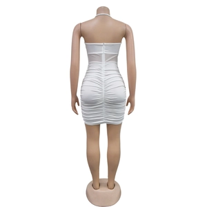 Detailed back view of white ruched bodycon dress with sheer mesh and hidden zipper