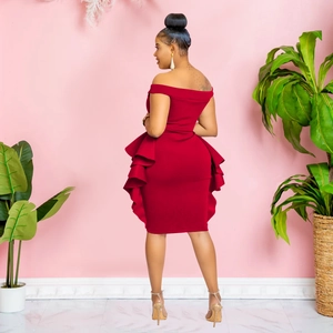 Detail view of the deep red off-shoulder dress featuring tiered ruffle layers on the hem