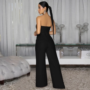 Rear view of sleek black strapless jumpsuit featuring high waist wide leg and slim fit design