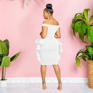 Close-up of white off-the-shoulder midi dress featuring layered ruffle side details