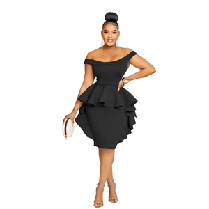 Detailed view of the double peplum waist design on a black off-shoulder fitted dress