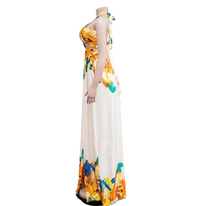 Detail of the backless halter neckline and cutout waist on this floral print maxi dress
