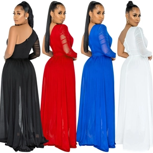Detail of sheer mesh long sleeve and side ruching on one-shoulder evening jumpsuit