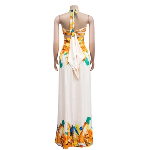 Detail view of the halter neck tie and abstract floral pattern on a backless maxi dress