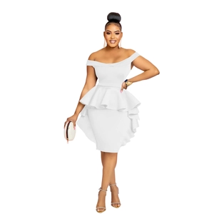 Detail showing the ruffled layered waist design and white fabric texture on this fitted dress