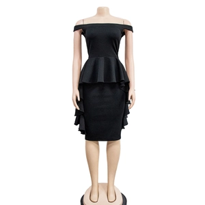 Detailed view of the ruffle peplum waist and layered hem on a black off-shoulder dress