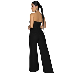 Detail of the high waist wide leg jumpsuit showing back silhouette and fabric texture