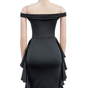 Detail of the cascading ruffle on a black off-shoulder formal evening gown