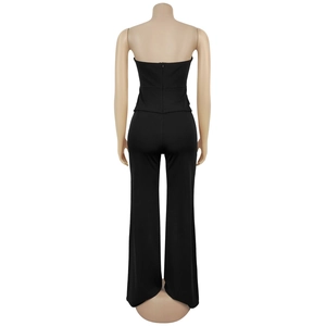 Back view of black strapless jumpsuit featuring a sleek hidden zipper and wide-leg design
