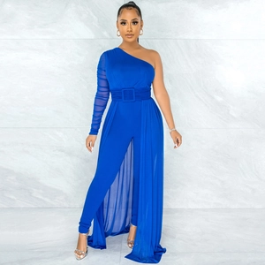 Detail of royal blue one-shoulder jumpsuit with sheer mesh sleeve and flowing floor-length overlay
