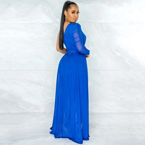 Detail of royal blue jumpsuit with sheer mesh long sleeve and elegant ruching detail