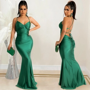 Detailed view of emerald green satin evening dress featuring crisscross back lace-up straps