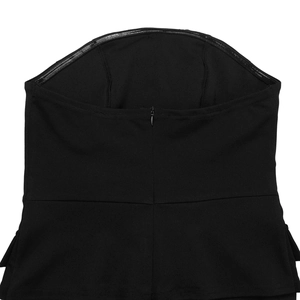Detail of back hidden zipper and anti-slip silicone strip on black strapless jumpsuit