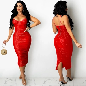 Detail of red sequin bodycon midi dress featuring sweetheart neckline and back slit