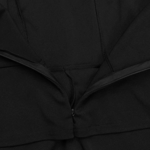Detailed macro view of the invisible zipper and clean stitching on a black jumpsuit