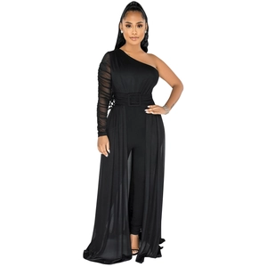 Detail view of the one-shoulder mesh sleeve and belted waist on the black bodysuit dress