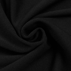 Macro detail of breathable black textile fabric with fine textured pique weave and soft drape