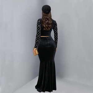 Rear view of elegant black velvet two-piece set featuring pearl bead lattice sleeves and fishtail skirt