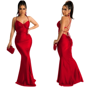 Detail of red satin evening gown showing sexy criss-cross backless tie and ruched design