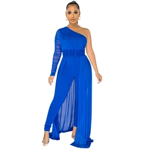 Detail of royal blue one-shoulder jumpsuit with sheer mesh skirt and waist belt
