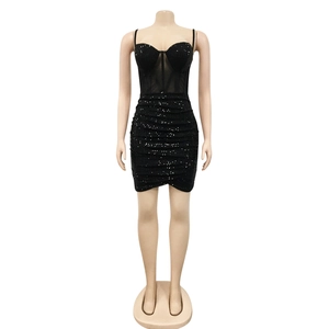 Detail of black sequined mini dress with sheer mesh panel and pleated asymmetrical hemline