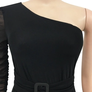 Detail showing the one-shoulder mesh sleeve with ruching and square buckle waist belt