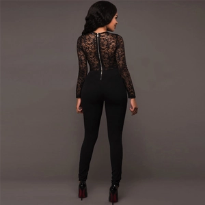 Detail of elegant black lace jumpsuit showing intricate floral patterns and back zipper