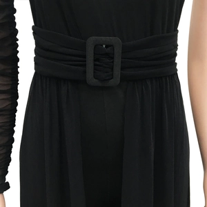 Detailed close-up of mesh waist belt with buckle on sheer black jumpsuit outfit