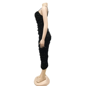 Detail view of black sequin ruched midi dress with spaghetti straps on a mannequin