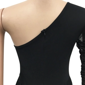 Detail of black one-shoulder dress showing sleeve ruffles and back zipper on mannequin