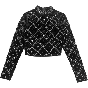 Detail of elegant black velvet crop top featuring intricate pearls and rhinestone patterns