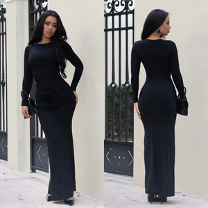 Detail of elegant black long-sleeve dress featuring side fan-shaped pleats and glitter fabric