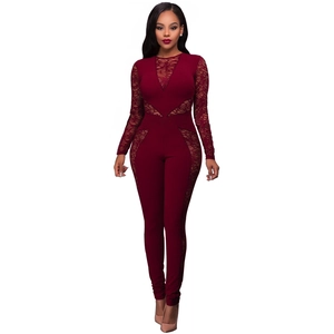 Close-up of wine red lace jumpsuit showing intricate floral details and slim fit design