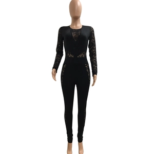Detail of black lace patchwork jumpsuit with sheer floral sleeves and cutout mesh design