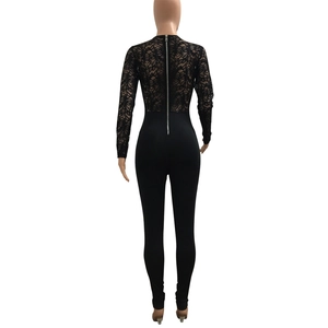 Detail of elegant black lace jumpsuit featuring sheer long sleeves and a silver back zipper