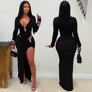 Detail view of black V-neck long sleeve two-piece maxi dress with side slit and gold waist link