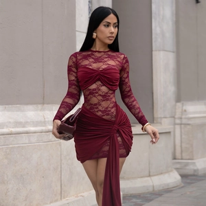 Detailed close-up of burgundy lace patchwork and elegant ruched texture on evening dress