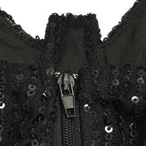 Close-up of black sequin dress featuring a metal zipper closure and detailed embroidery