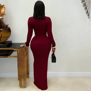 Detail view of the deep red knitted fabric and slim fit design of the long sleeve maxi dress