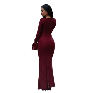 Rear view of elegant burgundy sequin evening dress with floor-length hem and back slit