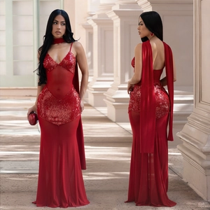 Front and back view of elegant red sequined mermaid dress with mesh panels and long cape