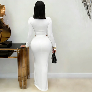 Rear view of white long sleeve crop top and slim fit maxi skirt two-piece set