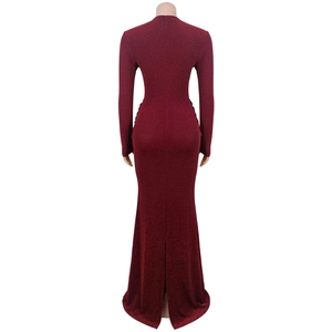 Back view detail of elegant burgundy sequin evening dress with a stylish rear slit hemline